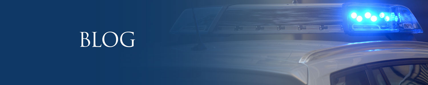 Cop Car with the top lights turned on- Blog, expunction process